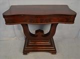 73  - Flame mahogany game table, 29 in. T, 36 in. W, 18 in. D.