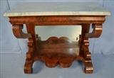 75  - Flame mahogany Empire marble top pier table with scroll feet and some damage, 38 in. T, 43 in. W, 19 in. D.