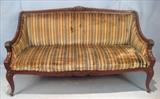 116  - Mahogany Victorian sofa with carved arms and crown and green stripe upholstery, ca. 1880, 37 in. T, 65 in. W, 26 in. D.