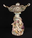 122  - Meissen porcelain figural flower centerpiece, ca. 1880, small hairline crack professionally repaired, 17 in. T, 15 in. W, purchased at Christies