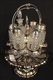 171  - Silver-plate and crystal cruet set, 16 in. T, 10 in. D.
