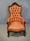 177  - Rosewood Victorian armed parlor chair with pink and gold upholstery, 45 in. T, 25 in. W, 21 in. D.