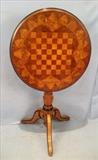 179  - Tilt  top checker table or  fire screen in excellent condition, 42  in. T, 23 in. D.