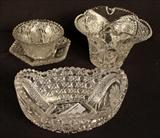 229  - Four pieces of mixed cut glass with damage.