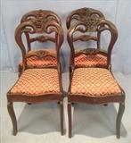 242  - Set of 4 rosewood dining chairs with rose top, saber legs and new upholstery, 34 in. T, 17 in. W, 16 in. D.