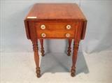 241  - Mahogany two drawer drop leaf work table with turned legs and glass pulls, 29 in. T, 19 in. W, 19 in. D.