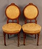 298  - Matched pair of walnut Victorian side chairs with round back, 34 in. T, 16 in. W, 17 in. D.
