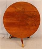 327a - Tilt top walnut table, 53 in. T, 43 in. D.