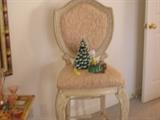 A pair of Italianate bar stools is featured among the furniture.