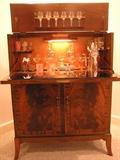 1930s English Drop Front bar with original key, Bird's Eye Maple interior, original interior mirror, and original key. All in near perfect condition.