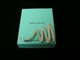 This Tiffany "Scribble" is one of three pieces of Tiffany we will sell, however we have dozens of vintage costume and Christmas jewelry. We additionally have a plethora of Disney items.