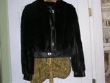 This custom made (size 6) mink and leather coat is one of the two minks, many dresses, shoes, boots, purses and perfume atomizers we have for sale.
