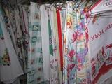 Just a sampling of the two thousand (2,000) vintage (30s and 40s) tablecloths, tea towels, and linens we have for sale.
