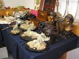 The foreground includes four (4) Richard MacDonald bronzes (Diana after the Chase, Cheetah Study I, II and III), bronze lion bookends, and bronze princess bookends. Mid includes a circa 1910 working Thorensing Music Box with disks and a stereopticon with slides. The other items and more are also for sale.