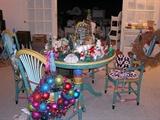 Who doesn't love Christmas. With two homes to combine, we have dozens (probably hundreds, this is a small sample) of Christmas ornaments, sweaters, stockings and displays for sale. In the background, you see whicker (we have a lot), pots, boxes of dvds and cds, throw rugs, and painted furniture which is all for sale.