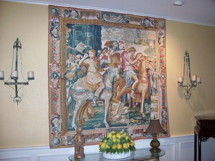 Large tapestry and great candle sconces...