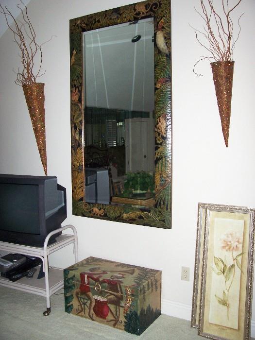 Jungle-themed wall mirror with matching chest.