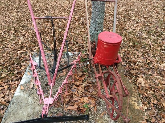 Metal and wooden-handled antique farm implements