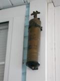 Brass fire extinguisher.