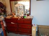 Dresser with small curio cabinet. 