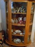 Curio cabinet with curved glass