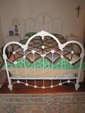 Fancy iron double bed with foundations.