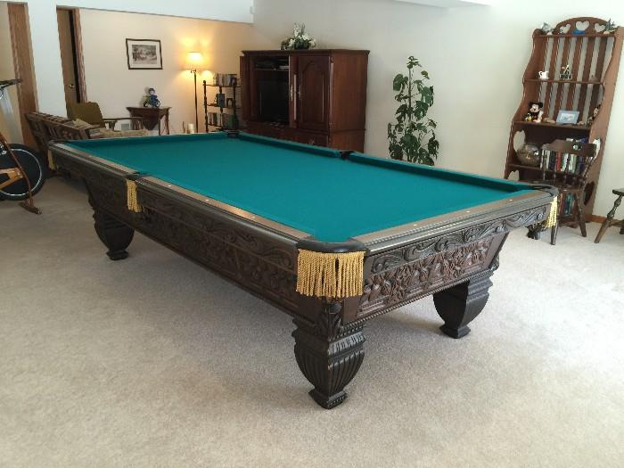 Brunswick 4' x 8' wood-carved pool table. Impeccable condition! Includes pool accessories.