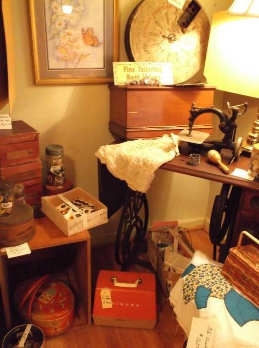 treadle sewing machine, sewing items, and Singer toy machine