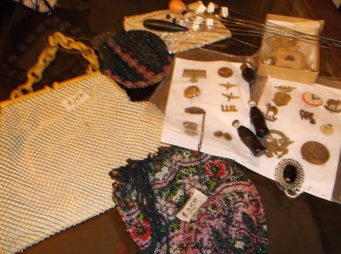 Beaded purses, hat pins, Coca-Cola lighters, and military pins