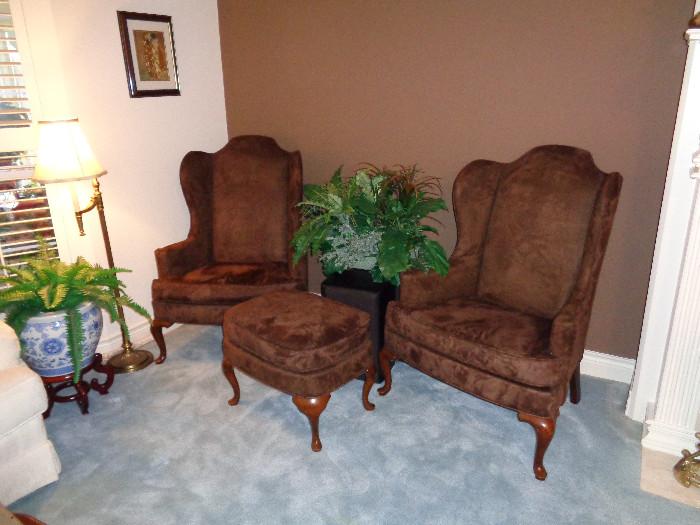 Chocolate brown wing back chairs and ottoman