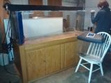  180 gallon Large Aquarium stands on wooden base; 2nd small aquarium