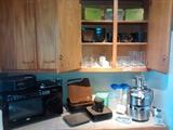 Assorted dinnerware, Jack LaLannes power juicer, microwave, stainless, glassware, much more not pictured here