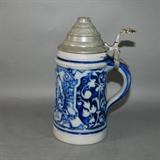 Antique beer stein, no back stamp, Delft blue on grey, raised relief scene of 18th century men celebrating ornate lid
Condition: Very Good
Shipping: Yes
Size:0.5 L - 8"