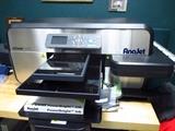 A mPower MP5 Digital Apparel Printer by AnaJet, for printing on t-shirts. Comes with a youth table and sleeve table.