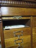 The doors slide up for each cubby hole. Look at the nice oak grain.