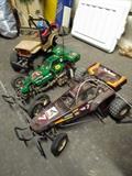 Three RC remote control cars, a Tamiya 1/10 Jeep, and two buggies