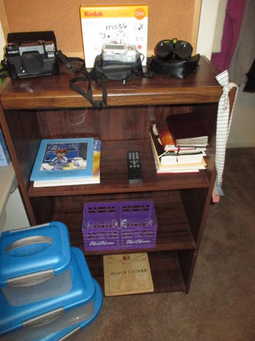 Minolta and Kodak Cameras, Bushnell Binoculars, Several Sweet Children Books, Sterilite Like New Containers