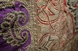 Close up of one of the pieces of antique and vintage fabrics for sale. 