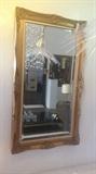 Rectangular wooden mirror with curving on the frame. 32"X56"
