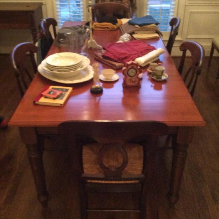 42"x48" solid wood farm table purchased from Mecklenburg Furniture, comes with 2 18" leaves, will seat 8 to 10 comfortably.  Lots of flexibility with this table!  6 Pottery Barn chairs, dark wood finish.
