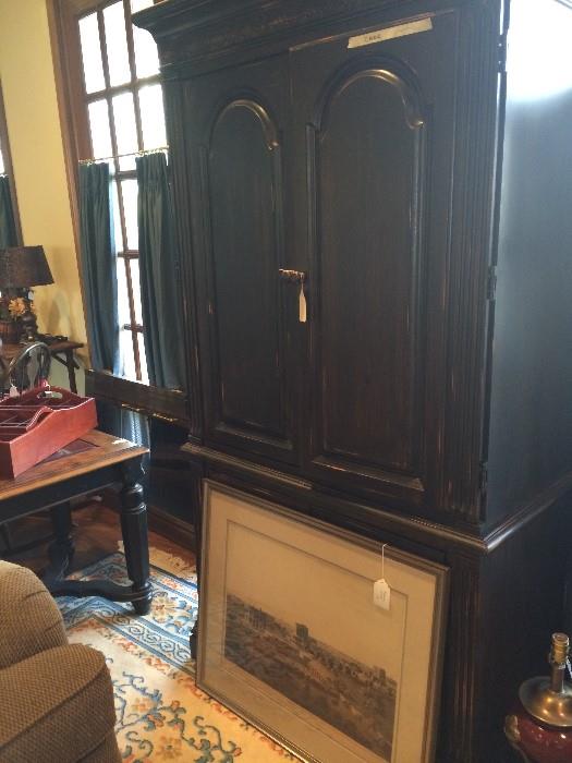                             Large black armoire