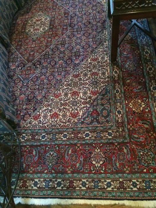            Large Oriental rug with burgundy & aqua