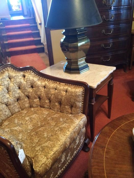 Antique gold chair; 1 of 2 marble top side tables; 1 of 2 brass lamps