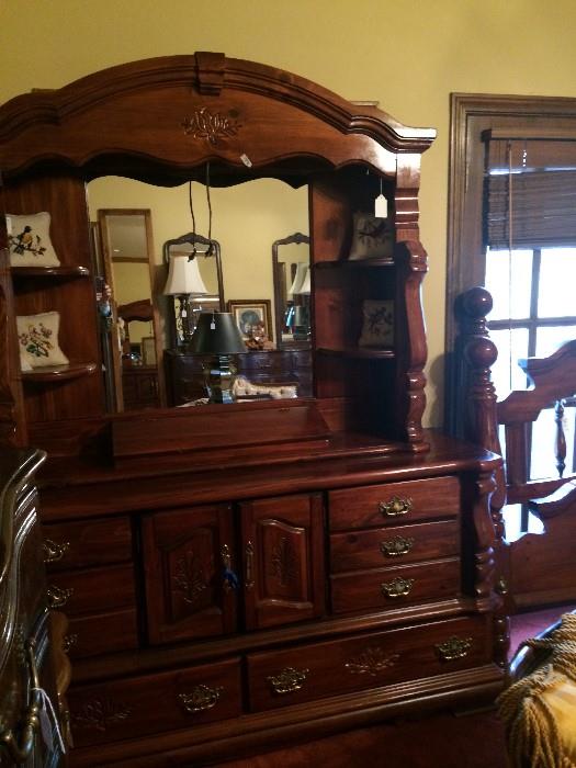      Dresser and king bed have matching nightstands.