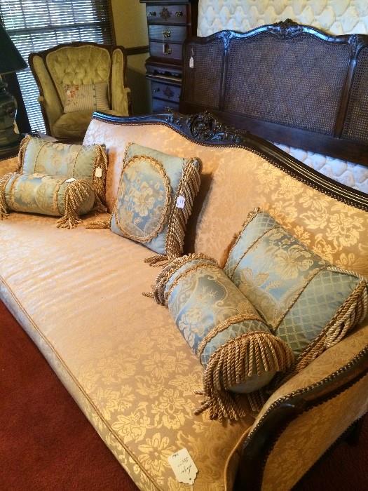 One of 2 antique sofas; lovely blue & gold pillows (has matching comforter); Henredon king headboard (behind sofa); antique chair  & 2 nightstands (back left);