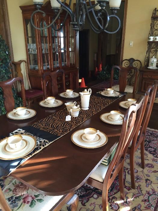 Double base Duncan Phyfe dining table; 6 needlepoint Queen Anne chairs; Syracuse Old ivory "Bracelet" (made in America) china; 1 of several table runners