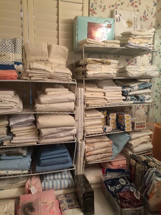 Huge amount of linens (some sheets still in packages), hosiery, & toiletries