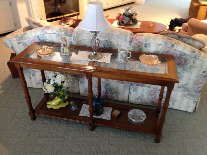 Lots of solid wood occasional tables like this beveled glass inset sofa table