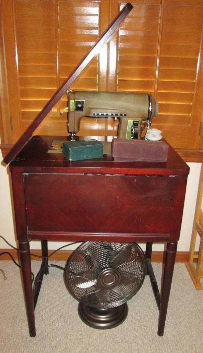 Vintage Kenmore sewing machine in cabinet, reproduction table fan
