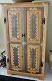 Southwest style cabinet with shelves